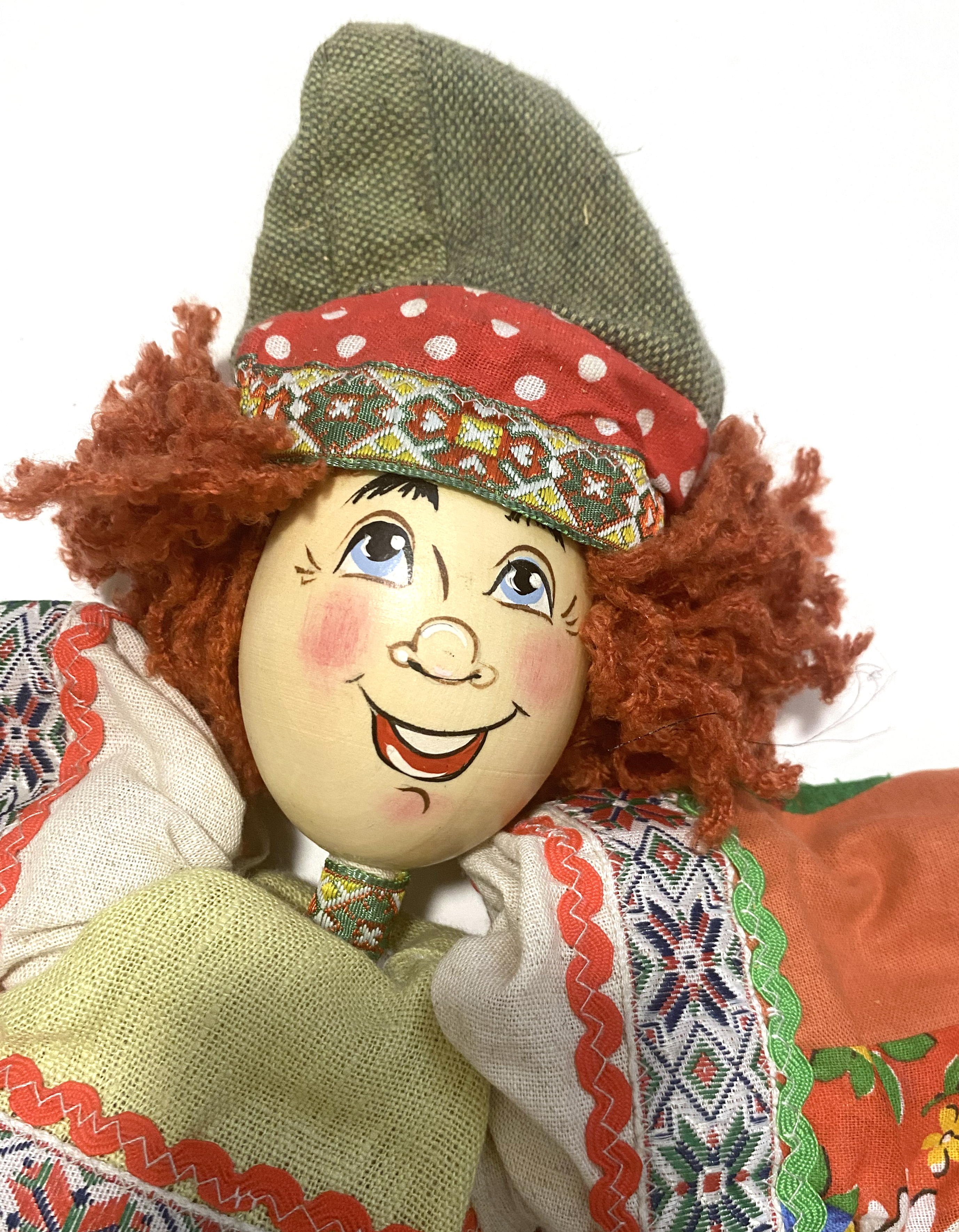 Cloth doll with wooden face, peasant boy