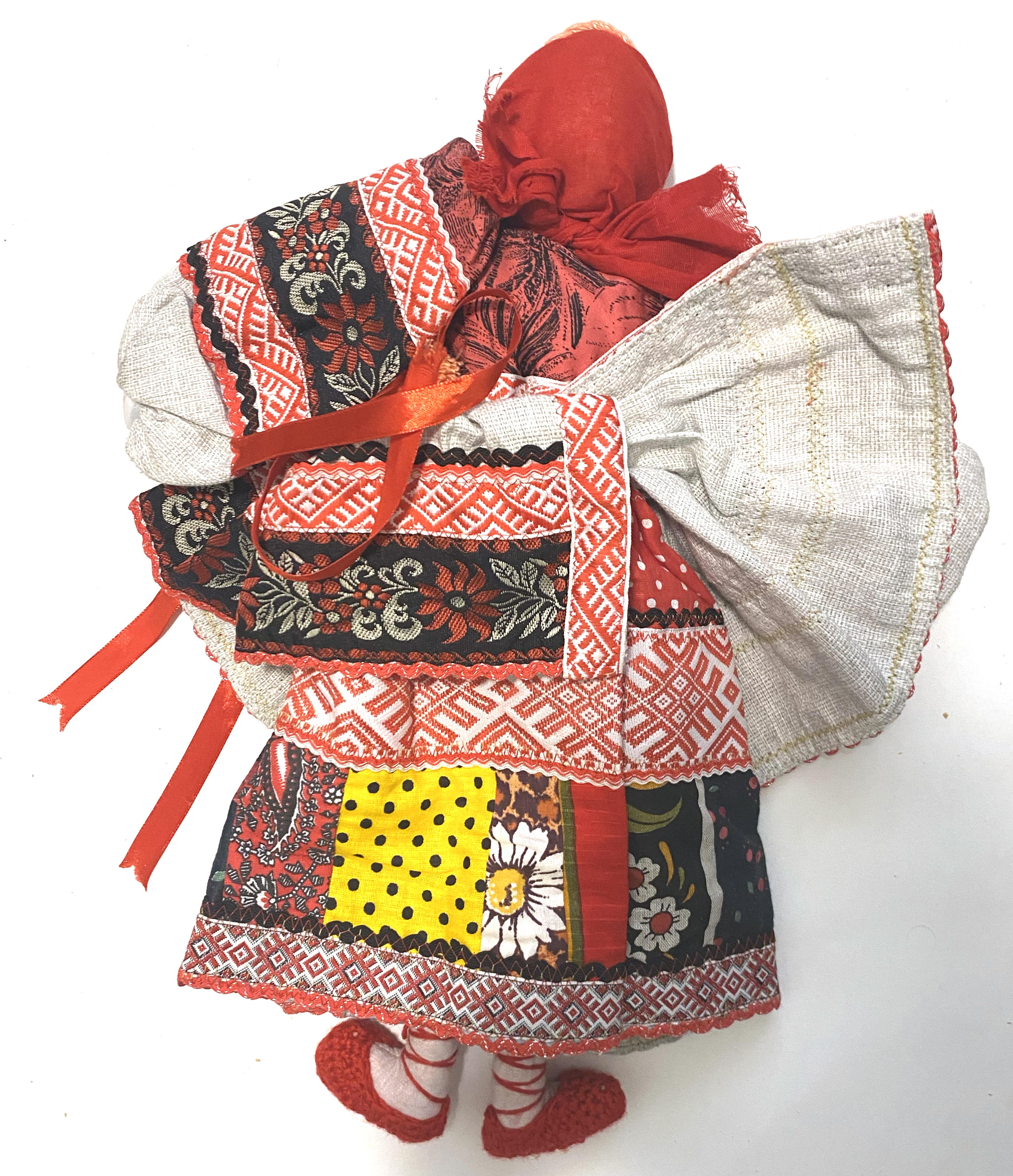 Cloth doll with wooden face, red black girl