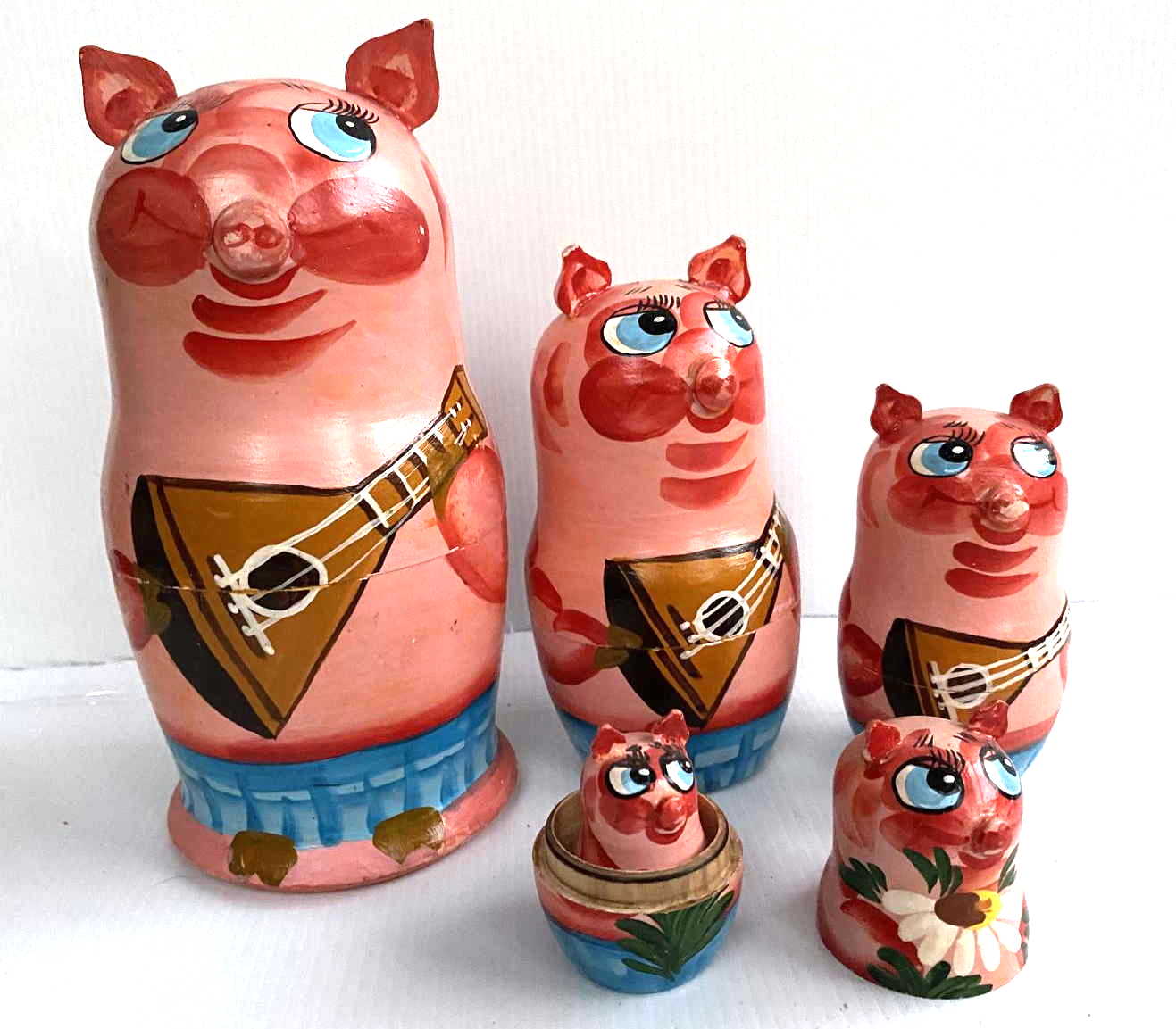 Artists Matryoshka by Semenov Zhanna Pig with balalaika