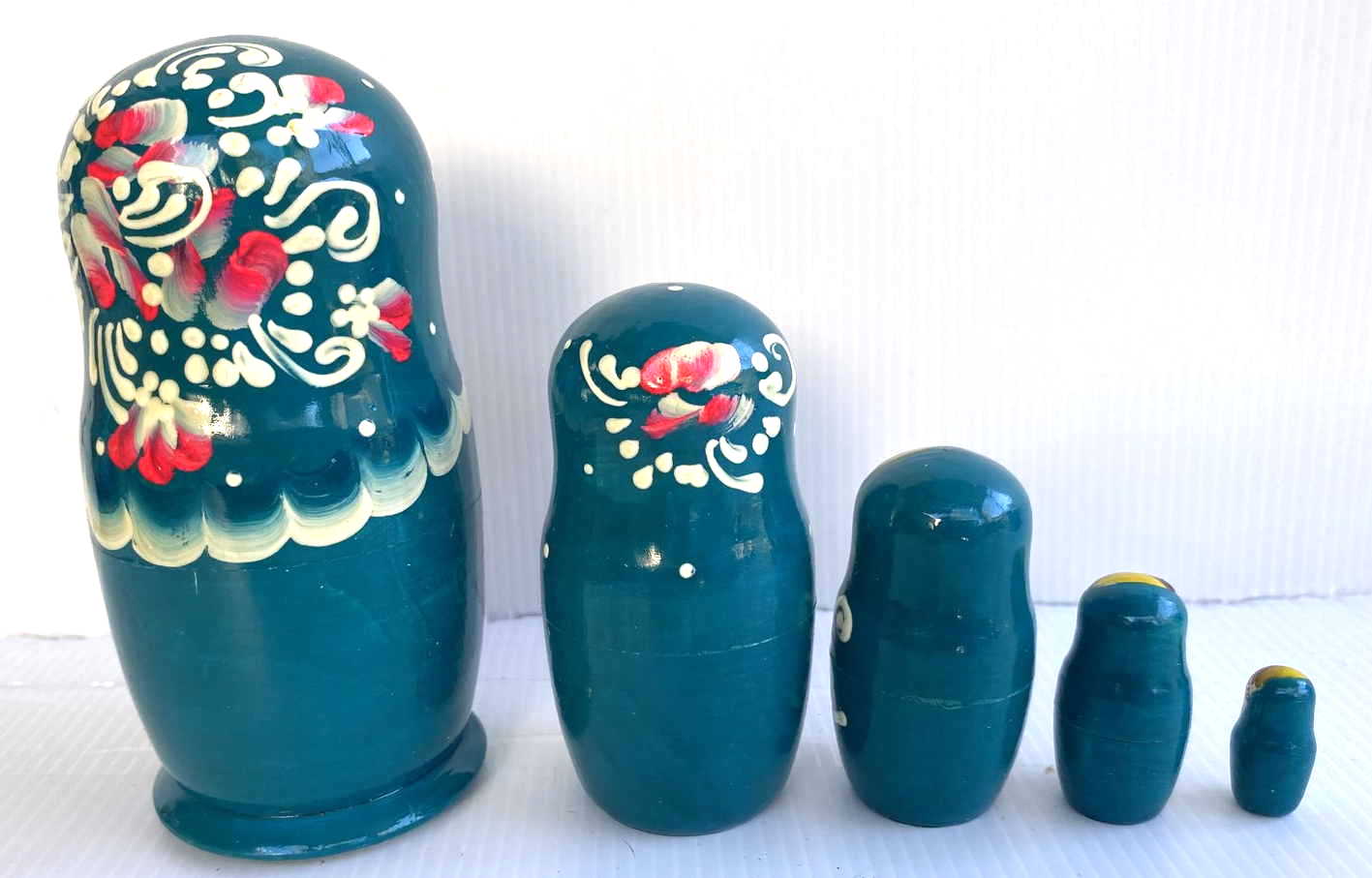 Green matryoshka with flowers