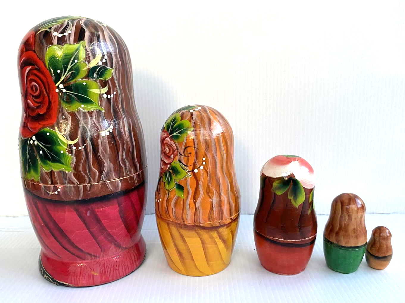 Artists Matryoshka woman clasping hands