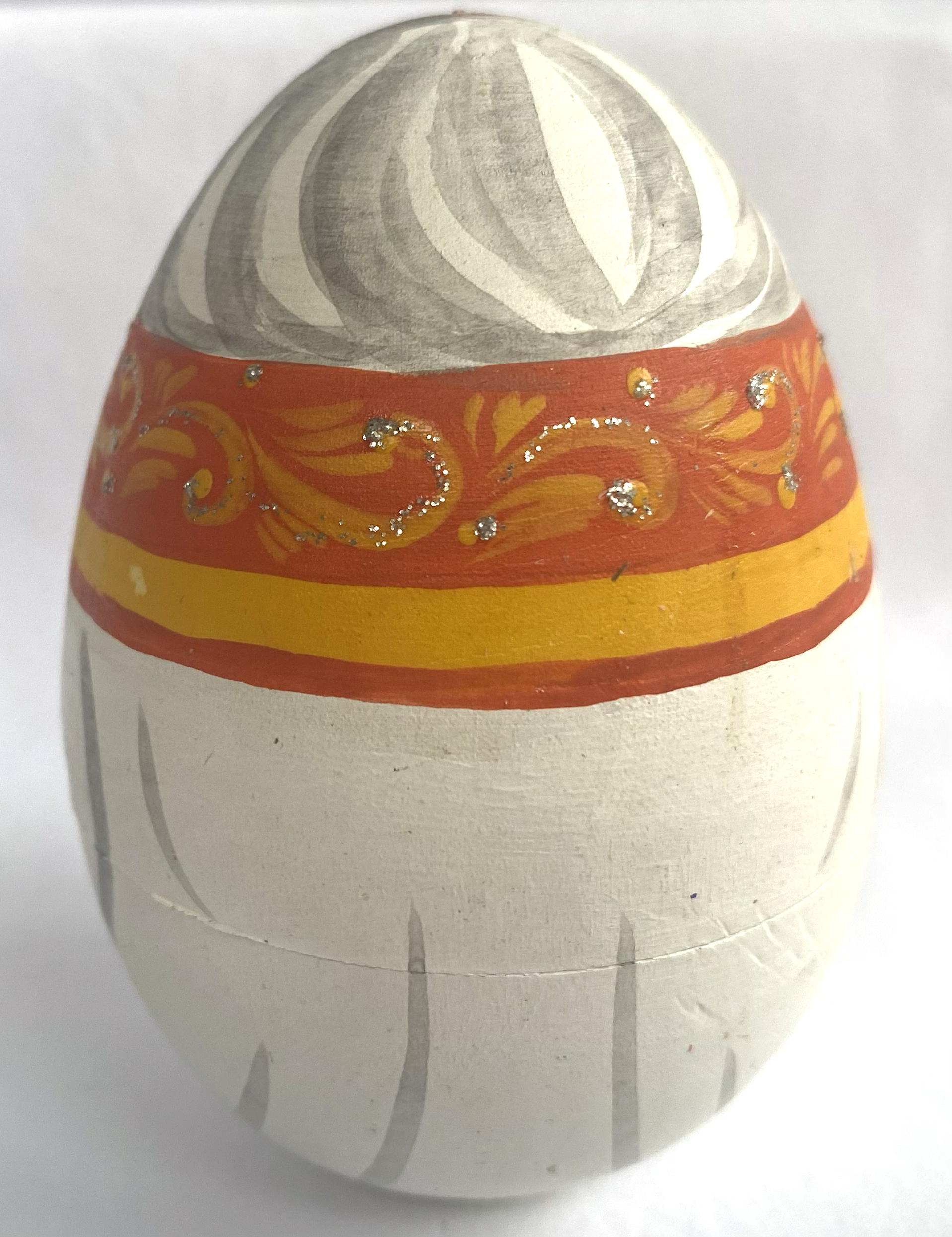Eggs Matryoshka by Ova - a roly poly man with cat
