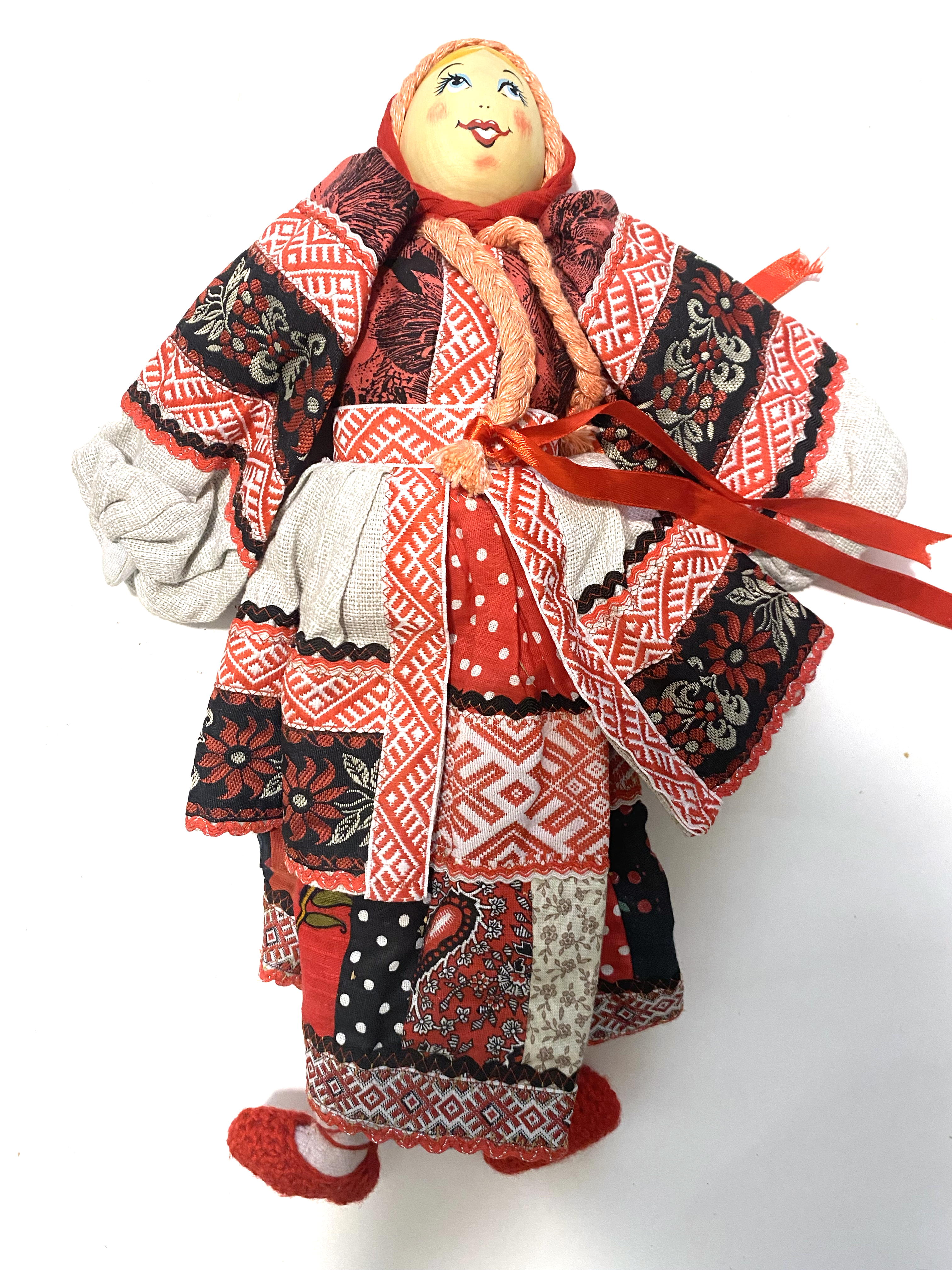 Cloth doll with wooden face, red black girl